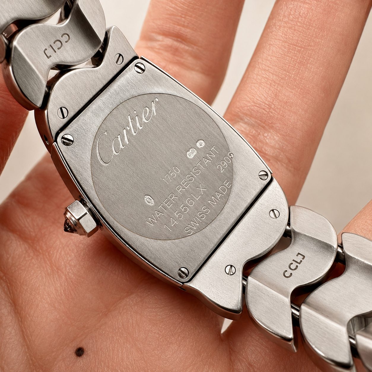 Cartier La Dona watch held in hand
