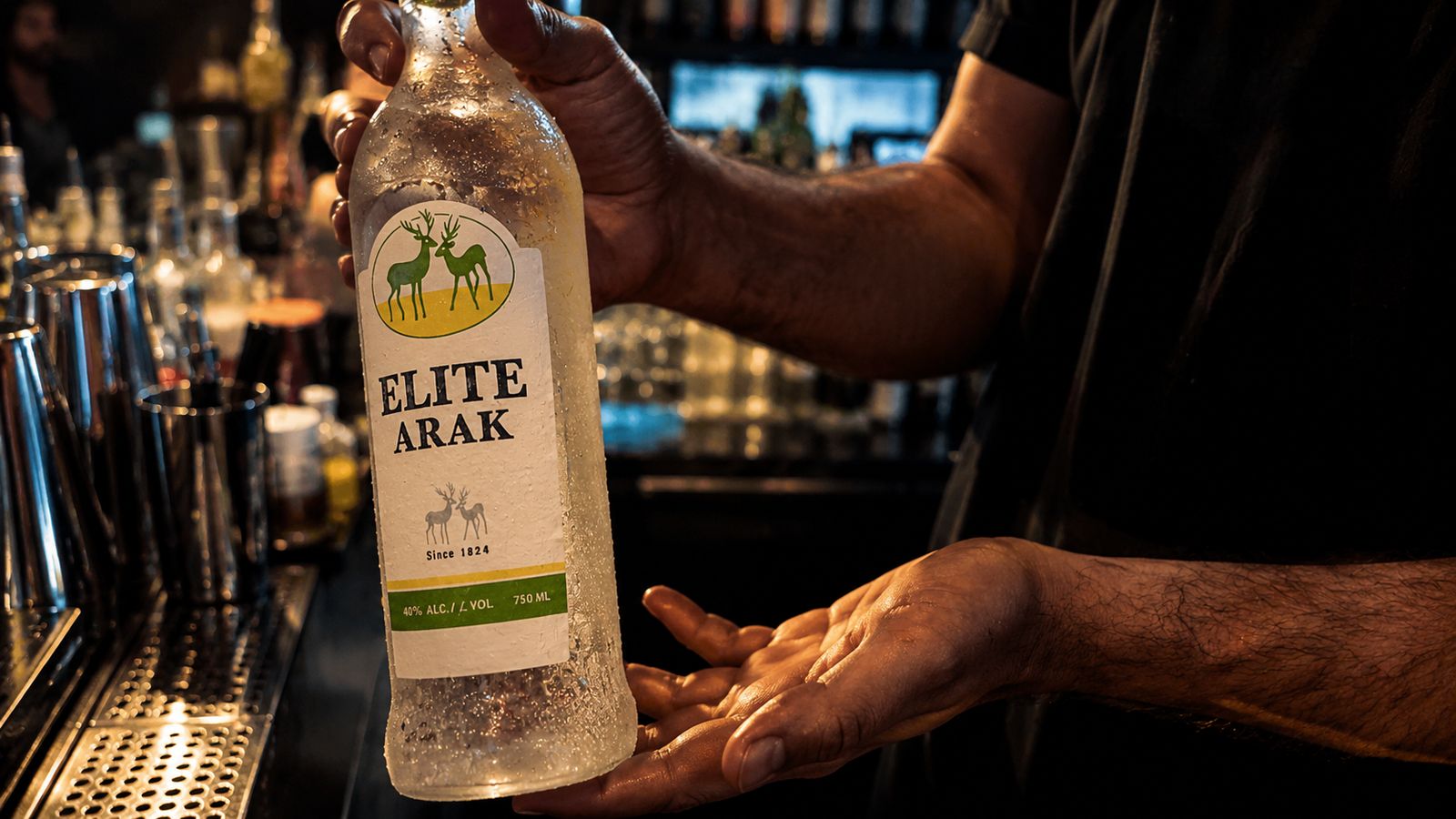 Elite Arak behind the bar